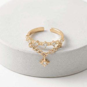 Anillo dorado abierto y ajustable con circonitas, cadena colgante y dije de estrella de ocho puntas